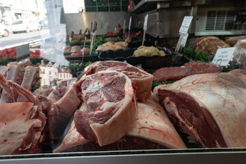 The butcher shop's Lumb Cuts display showcases a variety of raw, fresh meats for customers to choose from. Ledbury DT Waller and Sons