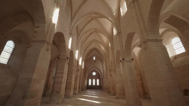 Beautiful view of the Abbaye de Noirlac corridor with columns