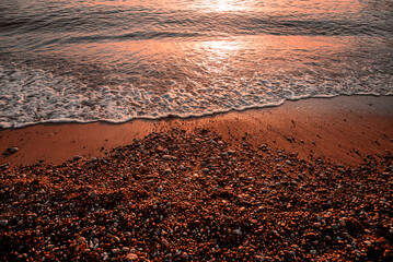 Red sunset on the beach in Budva Sveti Stefan