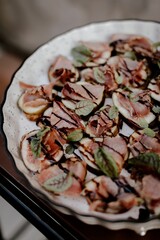 Top view of an appetizing snack featured with vegetation and a beacon