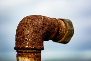 Detailed close-up photograph of an old, rusted metal pipe