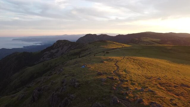 summer camping at sunset in Italy