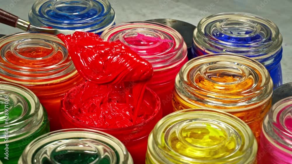Aufkleber stirring red color.use a trowel to stir the mass in a clear glass bottle..the subtle hues swirled to