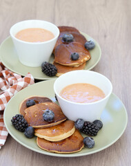 pancakes with fruit and berry smoothie