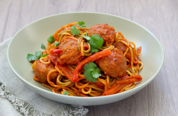 Tricolour spaghetti with vegetables and beef meatballs