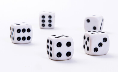 White game dice on a white background. Selective focus.