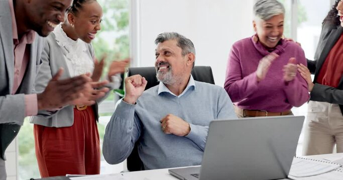 Man in office with laptop, applause and team high five for news of success, promotion or announcement. Congratulations, celebration and support for winning target achievement, business people cheers.
