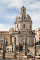 Fototapeta na wymiar Trajan's Forum and Church of Santa Maria di Loreto in the background, Rome, Italy.