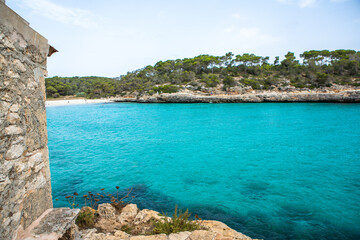 Beautiful sunset beach landscape, exotic tropical island nature, blue sea water, ocean waves, colorful red yellow sky, summer holidays vacation in Mallorca, Spain