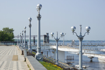 Street lamps in the Volga river port in Samara, Russia. A part of the Samara elevator can be seen in the far.