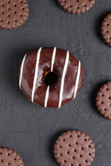 chocolate glazed Donuts covered with sugar crumbs in black background isolated close-up. Valentine's donuts. top view