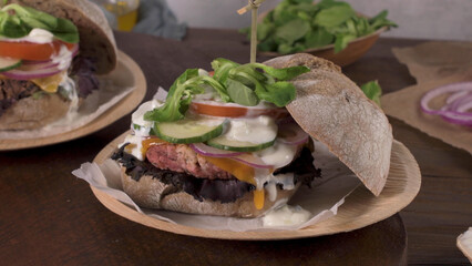 Healthy vegan burger with fresh vegetables and yogurt sauce