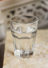 glass cup on a table, symbolizing clarity, transparency, and receptivity to new ideas and perspectives. Metaphor for openness