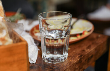 glass cup on a table, symbolizing clarity, transparency, and receptivity to new ideas and perspectives. Metaphor for openness