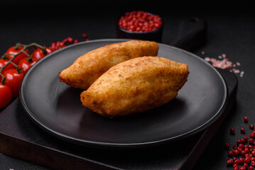 Delicious baked potato cutlet stuffed with chicken and vegetables, spices and salt