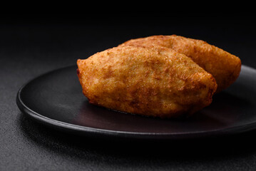 Delicious baked potato cutlet stuffed with chicken and vegetables, spices and salt