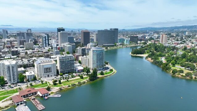 Aerial video following Lake Merritts shore line around Oakland City