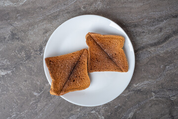 burnt bread toast on a plate. Bad breakfast concept