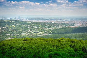Aerial view on the outskirts of Vienna city in Austria with the beautiful green hills of the...