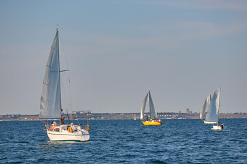 Sailing yacht regatta. Many sailing yachts in a row. sailing yachts under gennaker, speaker, genoa