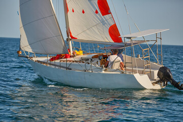 Sailing yacht regatta. Many sailing yachts in a row. sailing yachts under gennaker, speaker, genoa