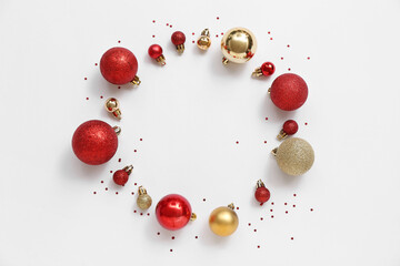 Frame made of different Christmas balls on white background