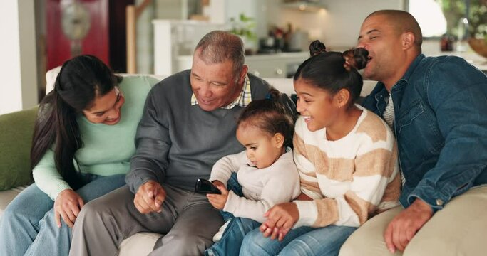 Family, learning and watching tv in home living room, bonding and happy together. Children, parents and grandparents streaming television teaching baby to use remote on sofa, funny and laugh in house