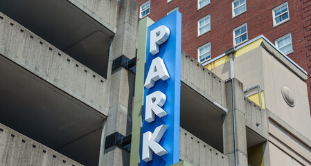 Park Here sign, representing space, convenience, access, and designated areas for specific purposes. Conceptual urban element