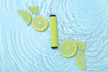 Electronic cigarette with lime in water on blue background