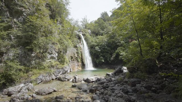 Beautiful waterfall in the green woodland