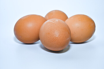 Free-range chicken eggs on a white background close-up