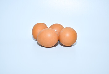 Free-range chicken eggs on a white background close-up