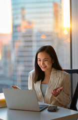 Young happy Asian woman executive team leader or hr manager having virtual video conference call...