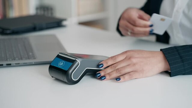  Video close up of hands charging with dataphone and paying with card