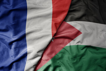 big waving realistic national colorful flag of france and national flag of jordan .