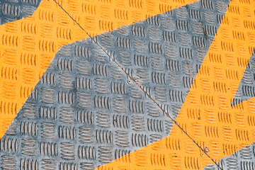 Metal floor with pattern shape and yellow cross