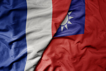 big waving realistic national colorful flag of france and national flag of taiwan .