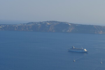 Boat sailing in the quiet shore landscape of Santorini, Greek Island