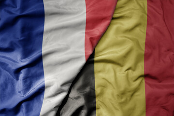 big waving realistic national colorful flag of france and national flag of belgium