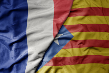 big waving realistic national colorful flag of france and national flag of catalonia .