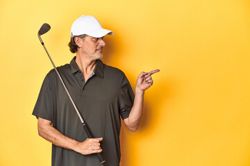 Middle-aged golfer with his club, epitomizing the golfing lifestyle, against a yellow backdrop.