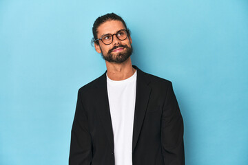 Businessman in suit with eyeglasses and beard dreaming of achieving goals and purposes