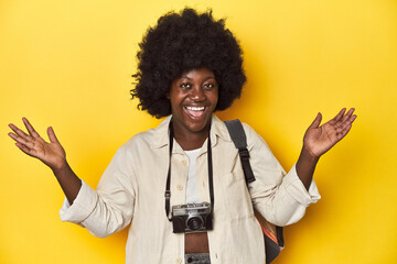 Stylish African-American woman with vintage camera Stylish African-American woman with vintage...