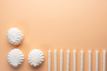 Background with marshmallows and  white cream tubes