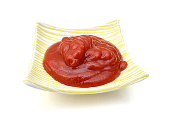 Small bowl of red tomato sauce ketchup. Isolated on white in perspective.