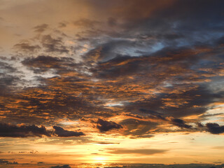 The sunrise is decorated with clouds in various shapes. Looks beautiful.