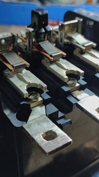 Contacts of a three-phase electrical contactor connecting and disconnecting. 4k footage Vertical