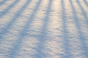 snow background with evening sunshades and shining crystals