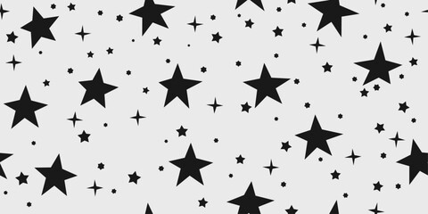 Obraz na płótnie Canvas Black casual stars on a white background. Seamless pattern with stars from the sky. Design for textile, fabric, clothing, ornament, background, wrapping.