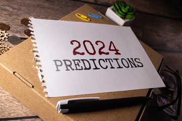 2024 Predictive Analytics text on yellow sticker on white keyboard.